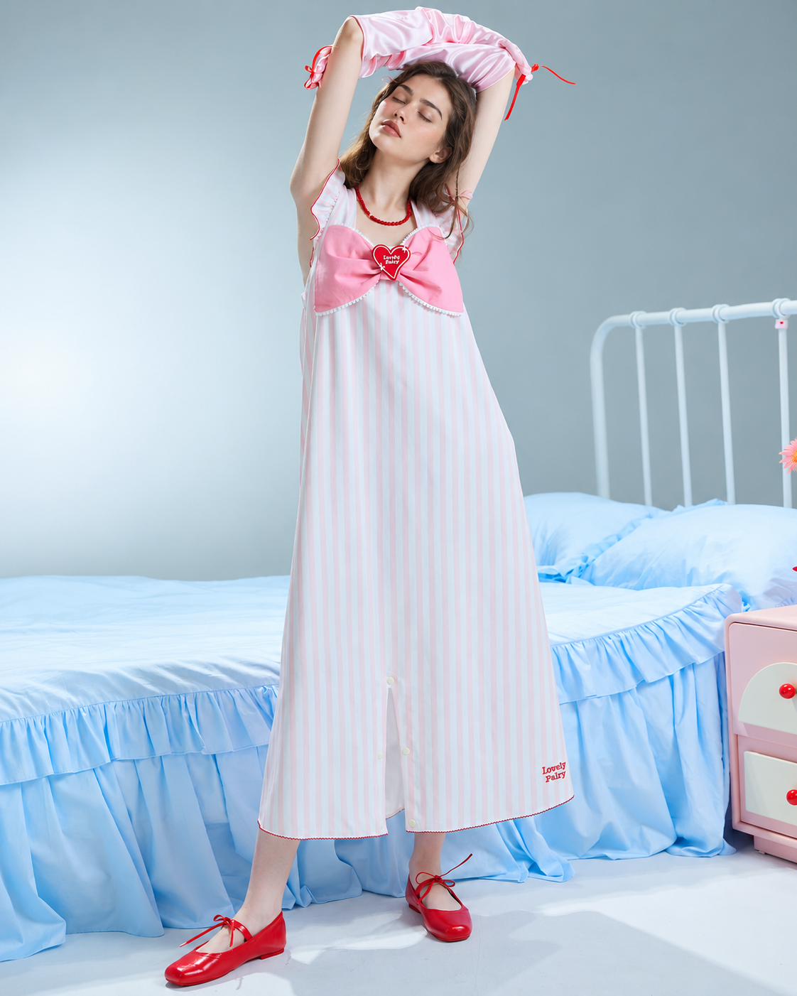 Heartparcel Pink Striped Convertible One-Piece Pajamas – full skirt-mode view with crossed arms overhead - Roomden