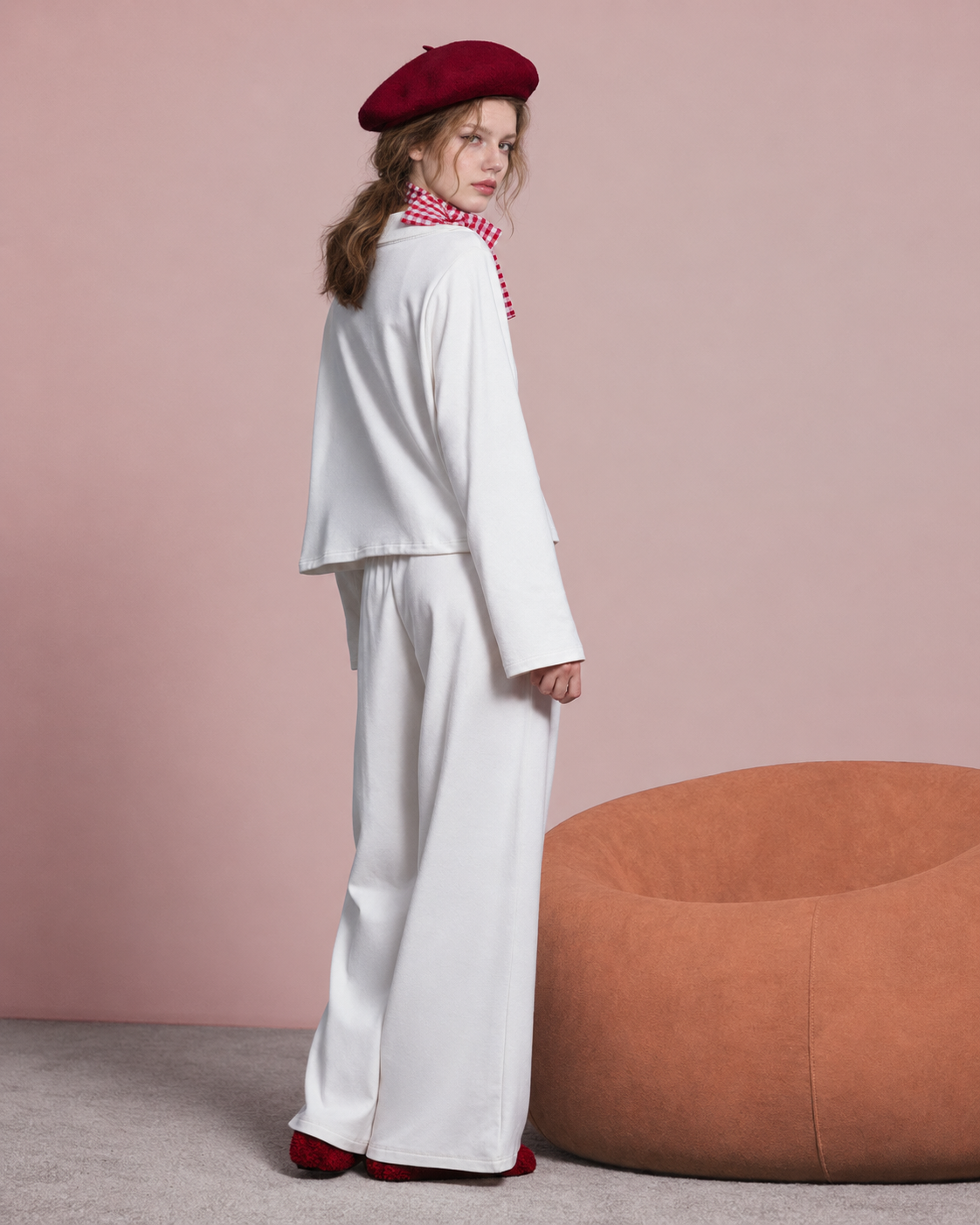 Back view of the ivory long-sleeved pajama top and trousers.