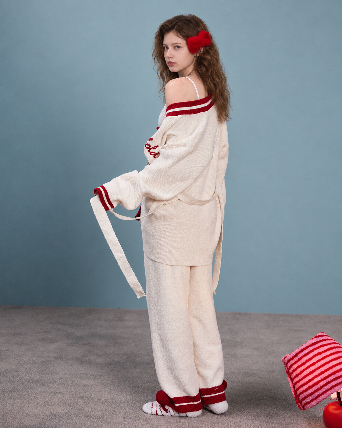 Back view of the ivory knit cardigan and trousers