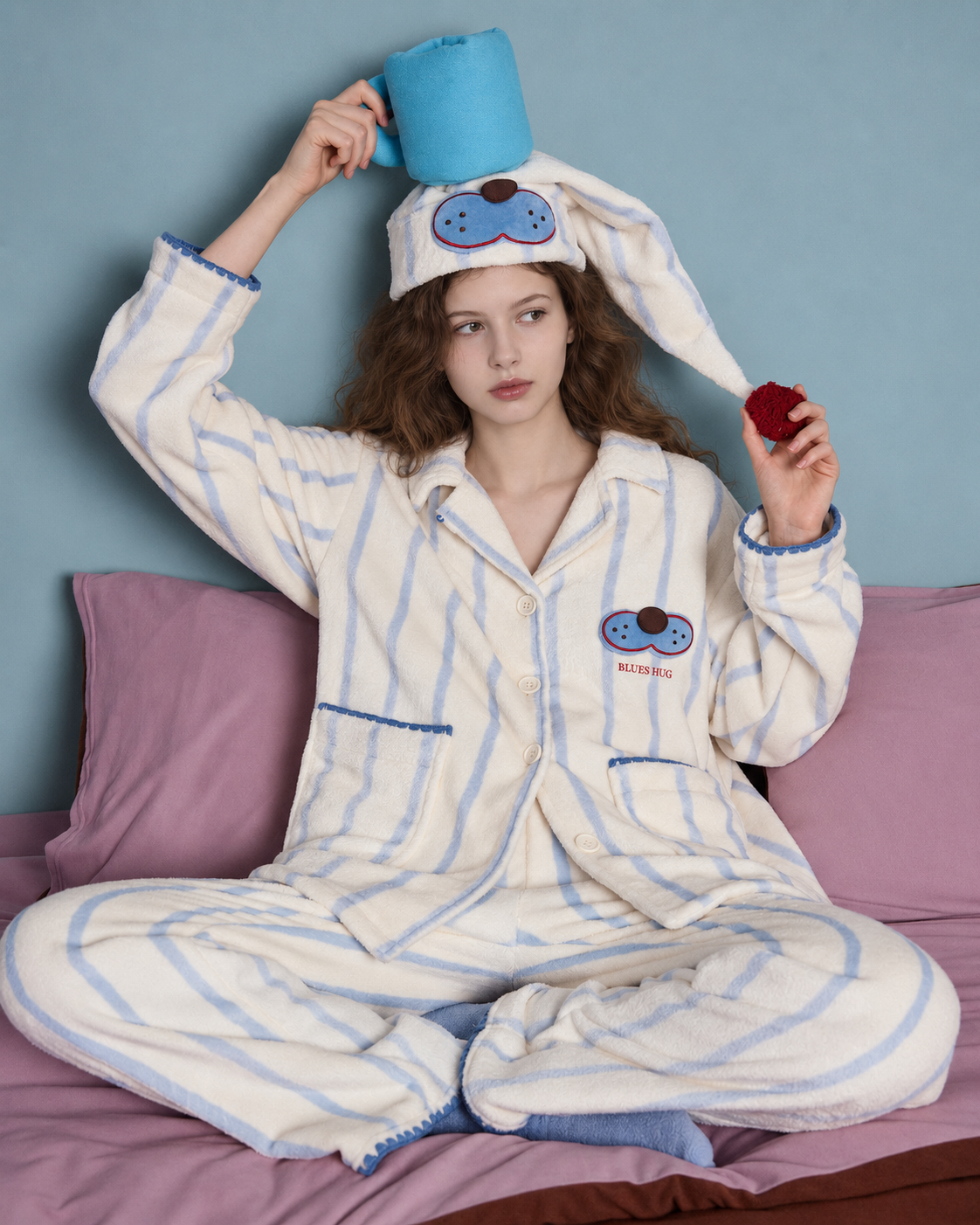 Striped Fleece Pajama Set – cross-legged seated view with a blue cup - Roomden