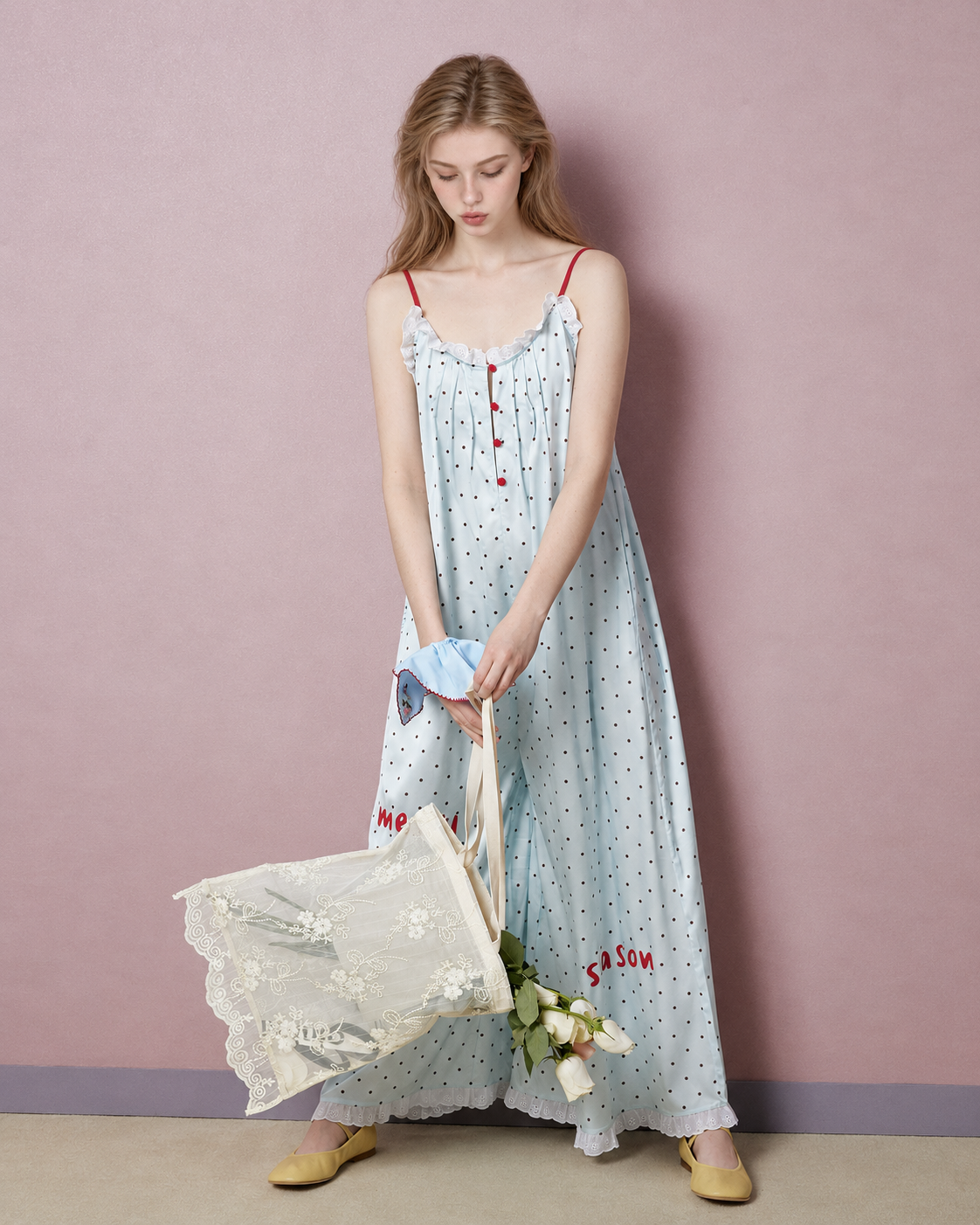 Full front view of pale blue polka dot pajama jumpsuit with lace bag - Roomden