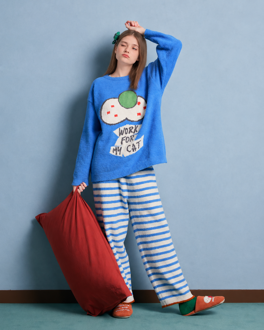 Blue cat graphic fleece pajama set with cream striped pants – Raised-arm standing view