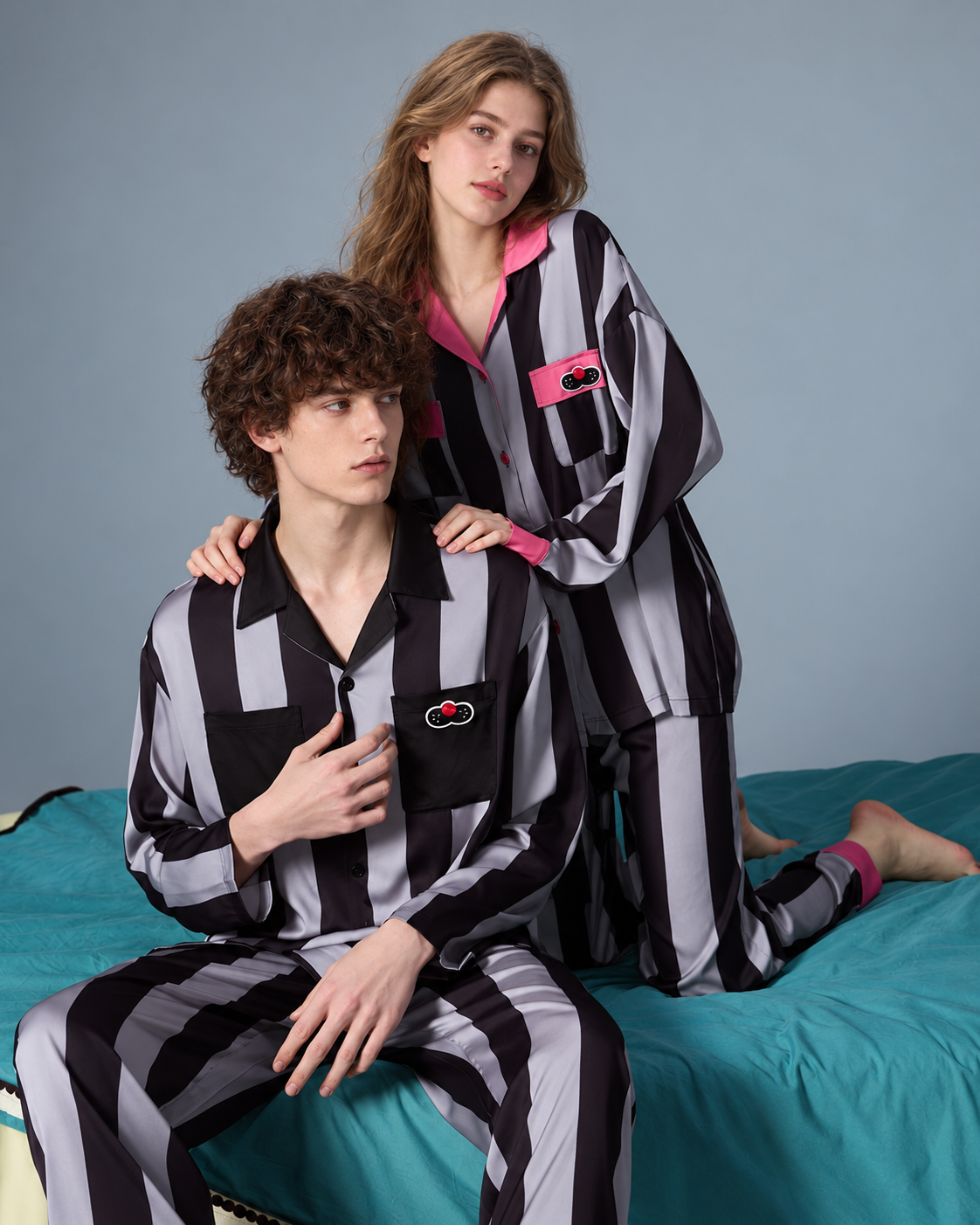 Men's striped pajama set – shirt and trousers shown seated with a companion - Roomden