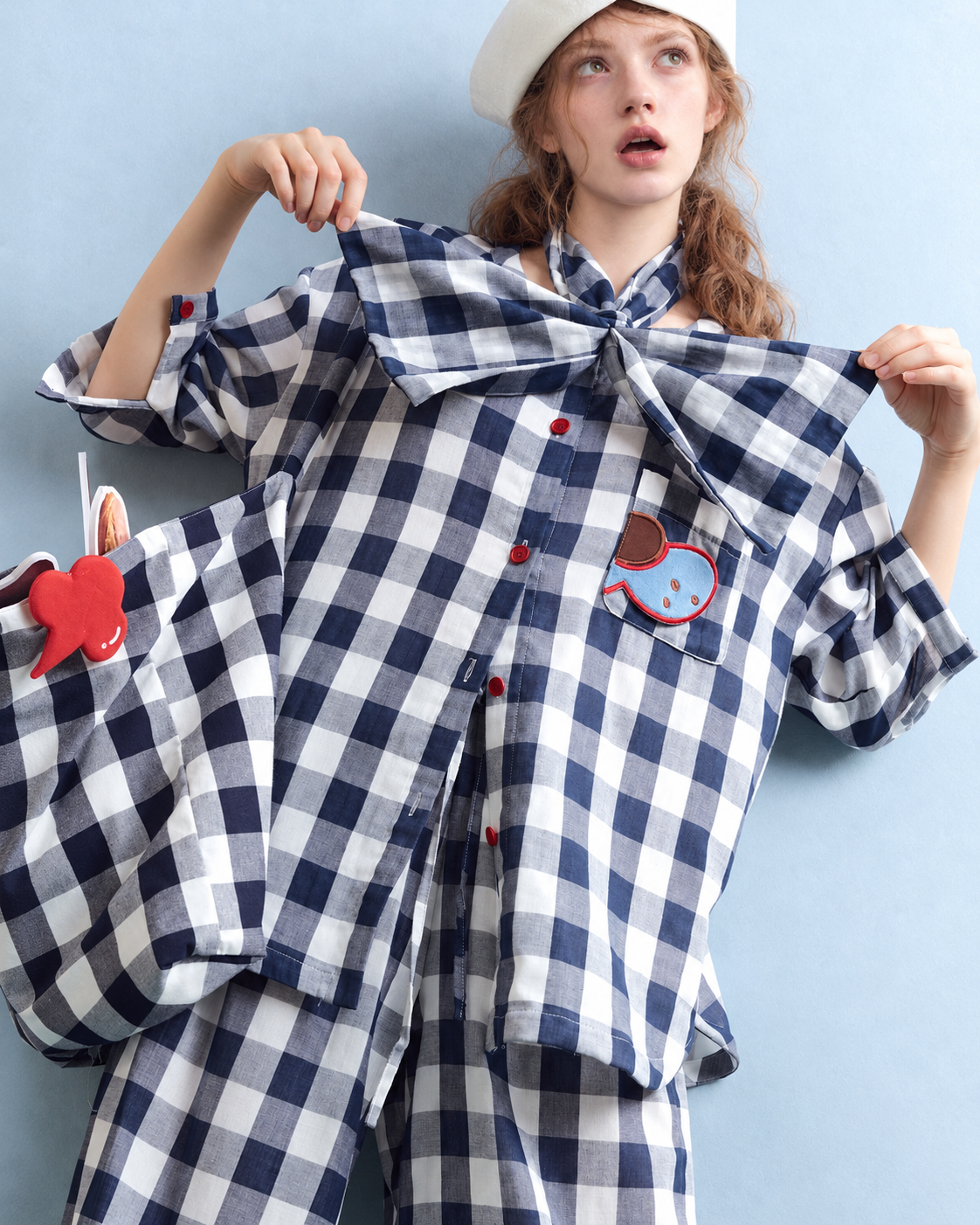 Cotton Double Gauze Pajama Set – navy checks, close view of fish pocket and red buttons - Roomden