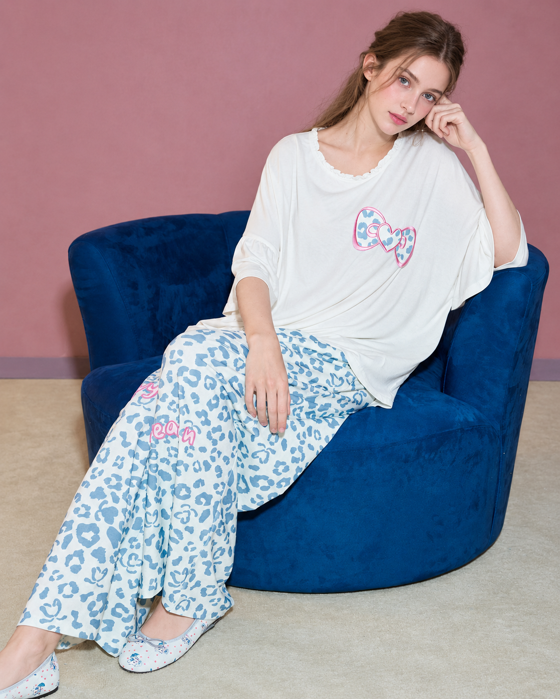 Heart Bow Cotton Blend Pajama Set – side seated view on a blue chair - Roomden