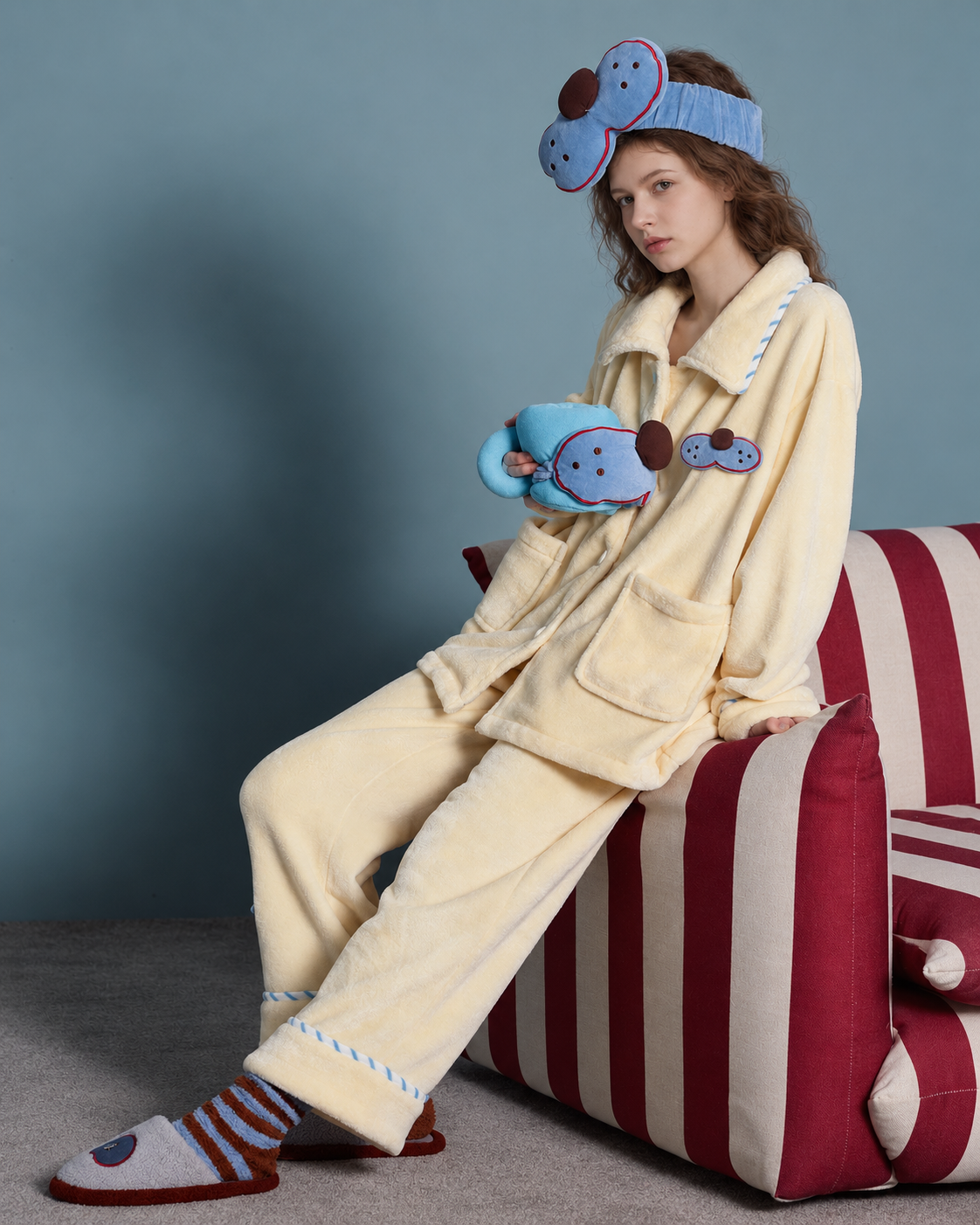 Cat Patch Fleece Pajama Set – cream yellow, seated side view showing the relaxed silhouette - Roomden