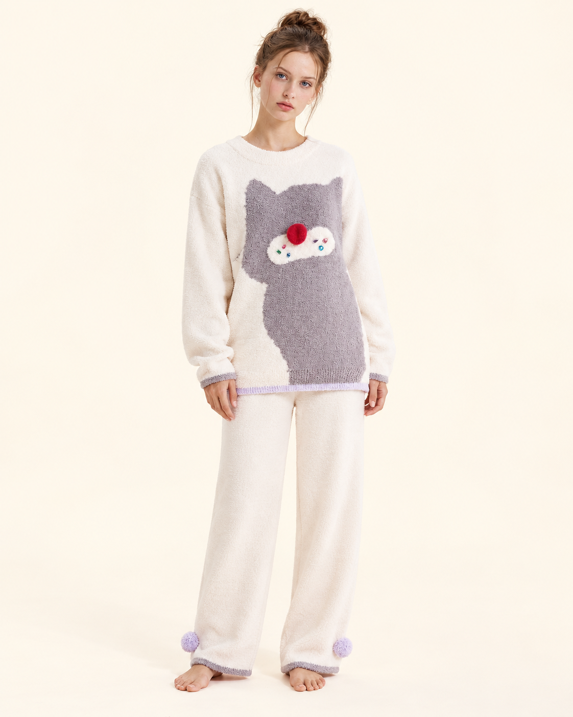 Ivory cat graphic pajama set – full front studio view with lavender ankle pom-poms - Roomden