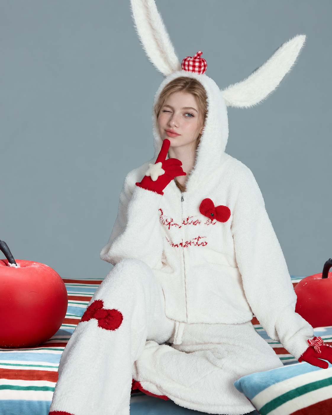 Red Bow Plush Pajama Set – ivory seated view with rabbit-ear hood up - Roomden