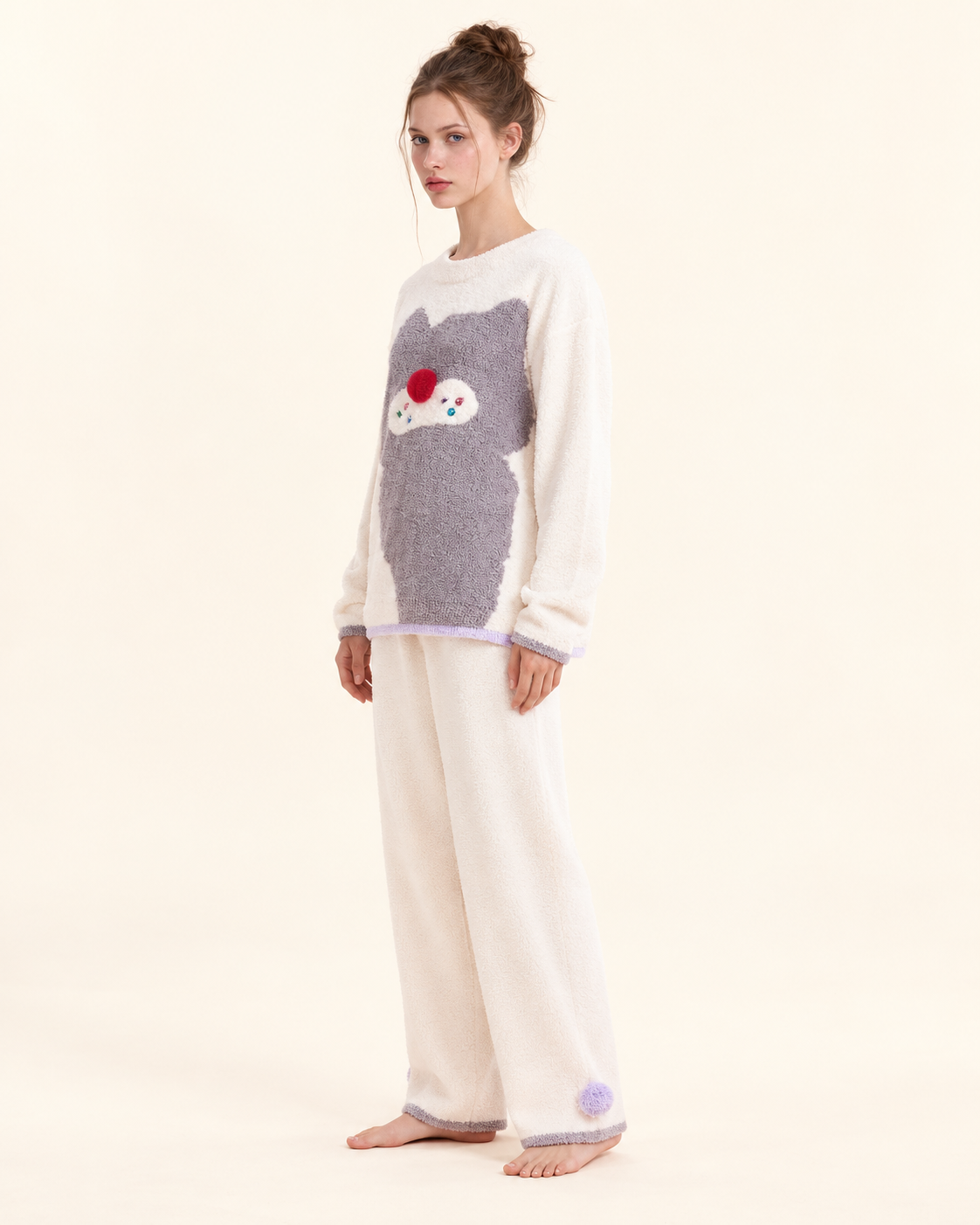 Ivory cat graphic pajama set – three-quarter studio view of the relaxed long-sleeve fit - Roomden