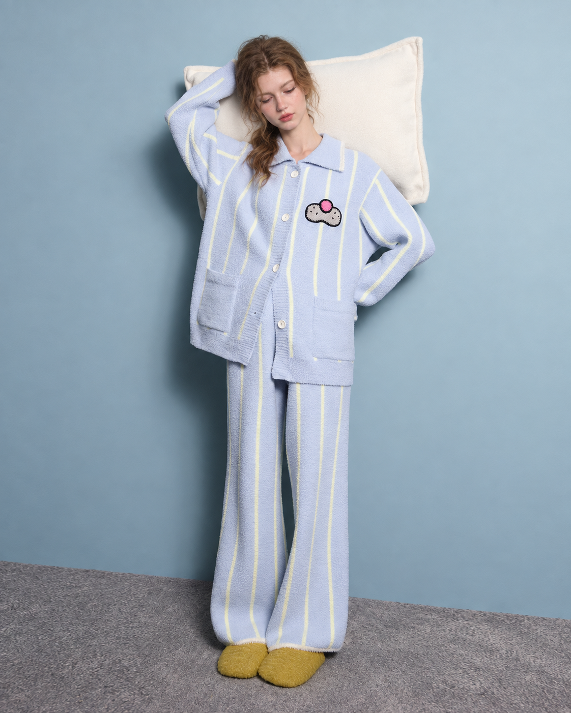 Striped Cat Motif Fleece Pajama Set – ice blue, standing with a pillow - Roomden