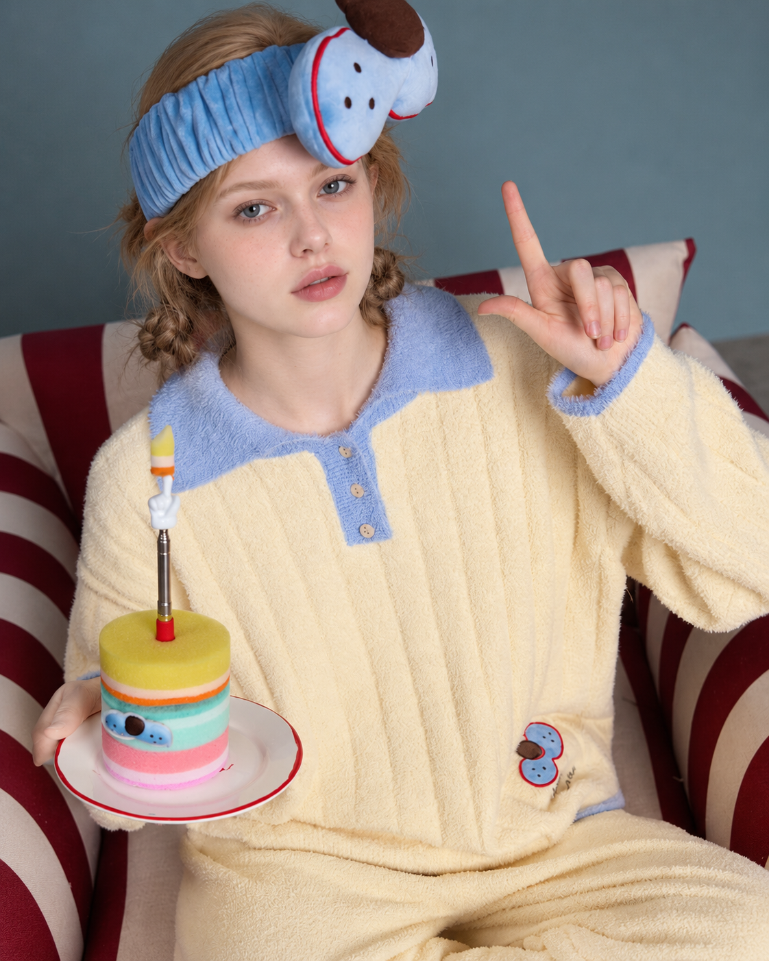 Plush Paw Print Pajama Set – cream yellow and blue close view holding a colorful cake prop - Roomden