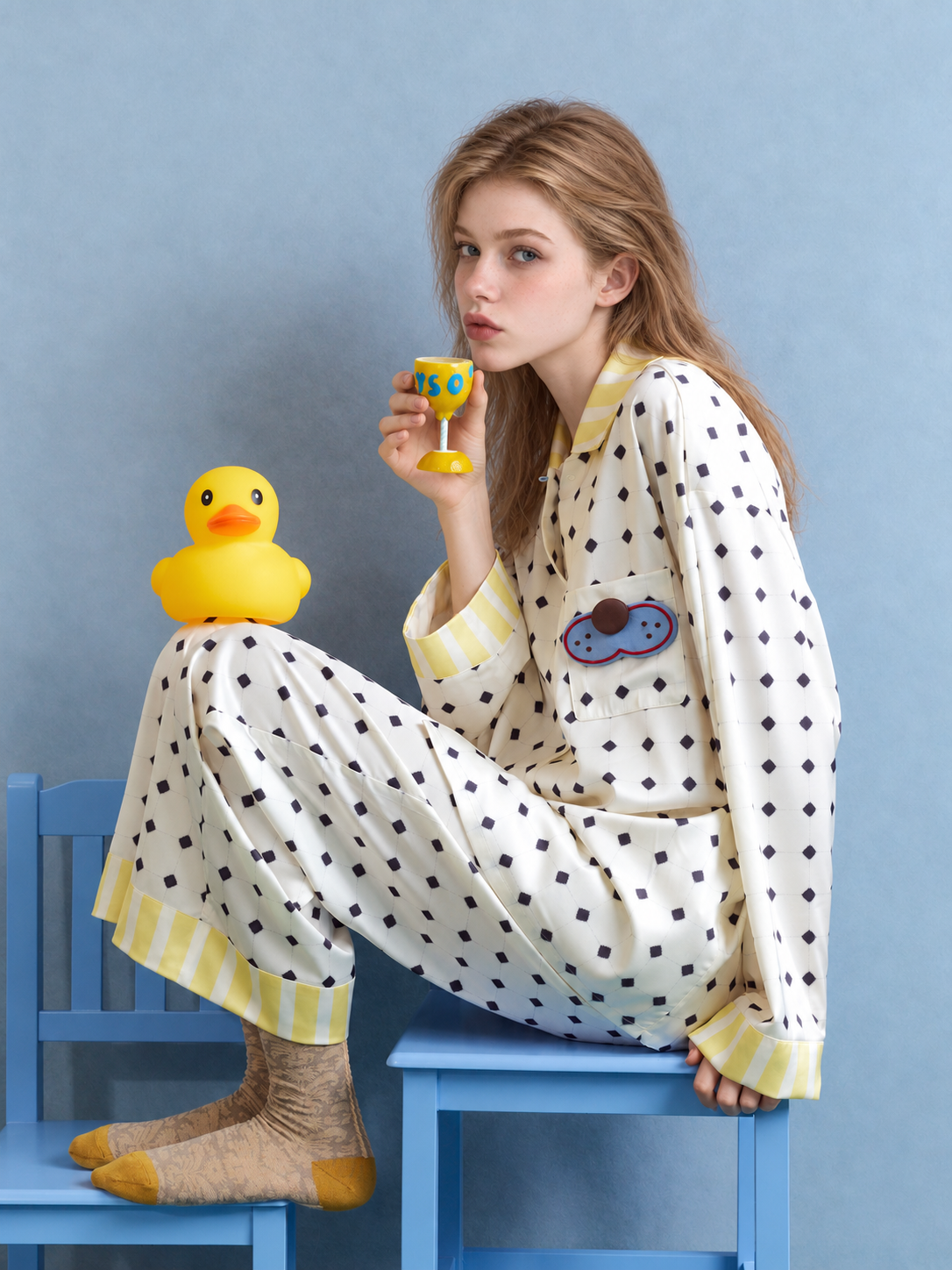 Lemonpause blue cat long-sleeve pajama set – side seated view on a blue chair - Roomden