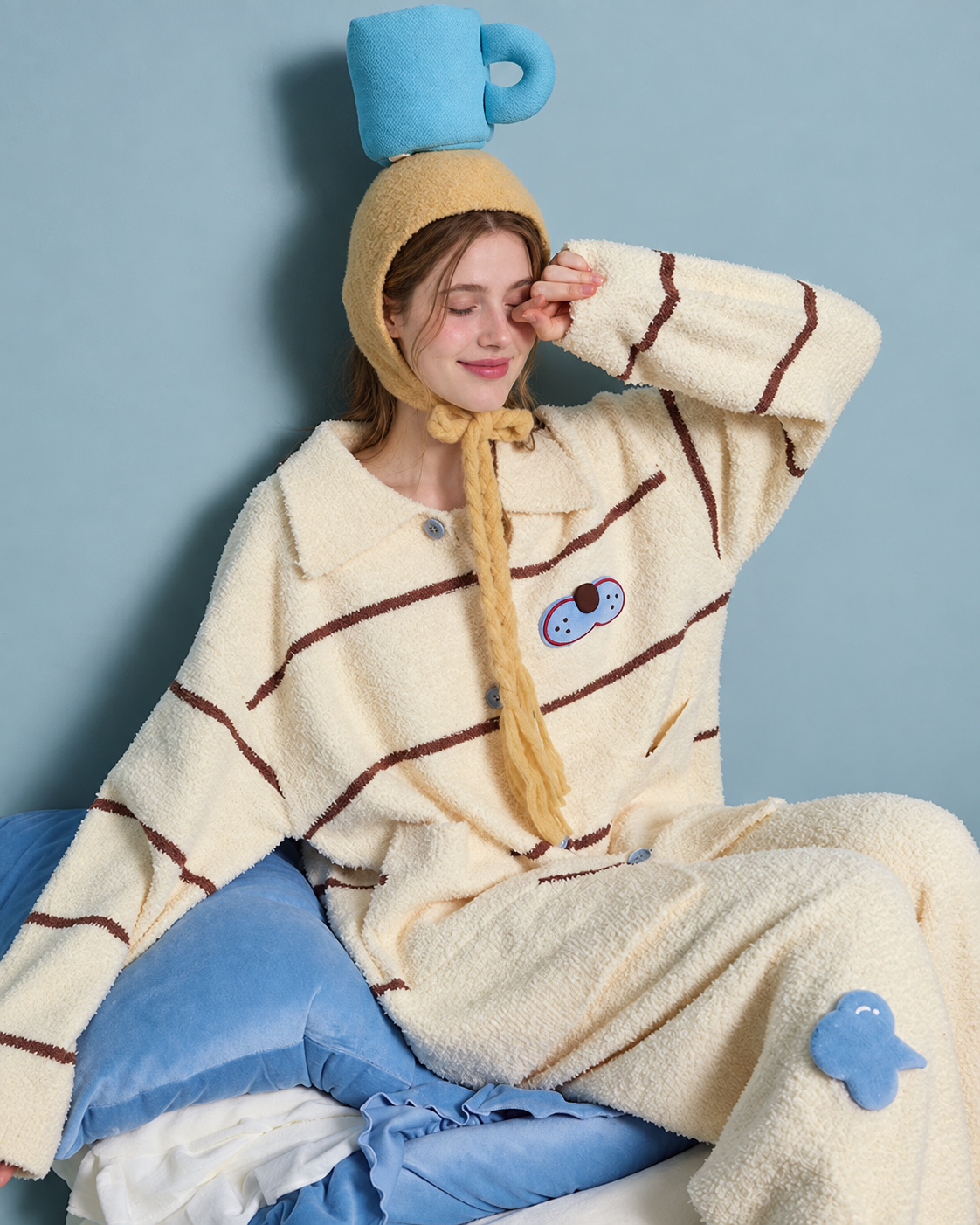 Striped Cat Fleece Pajama Set – relaxed seated pose showing blue appliqués - Roomden