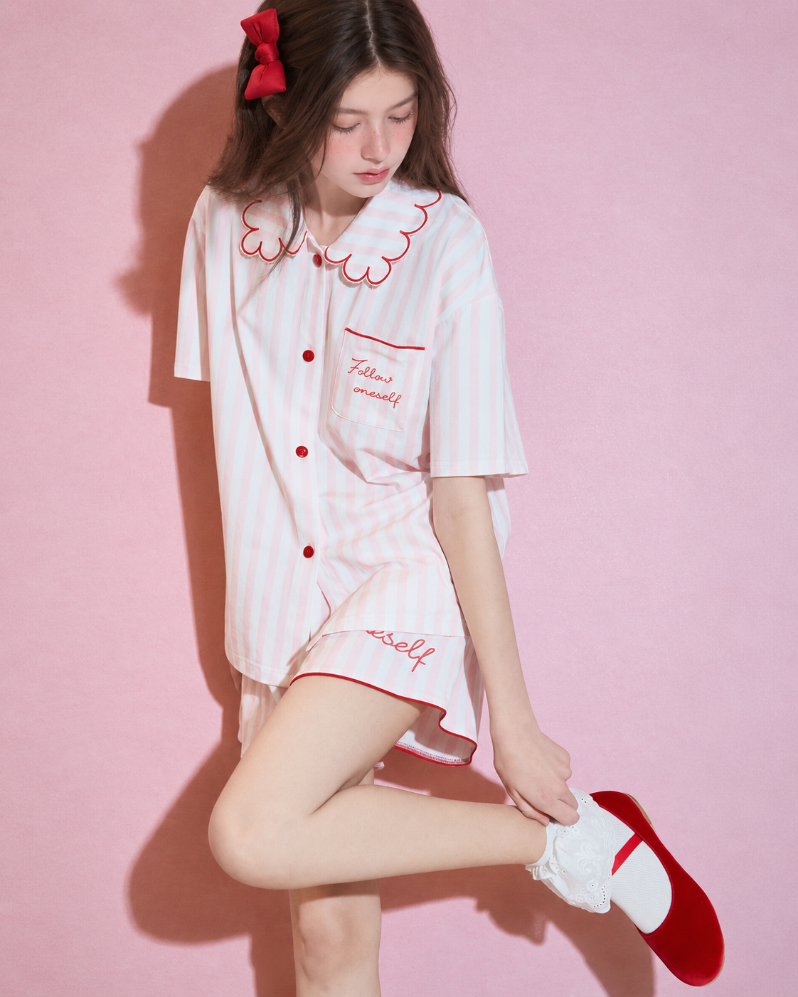 Scalloped collar striped cotton pajama set – pink and white, bent-leg side view - Roomden