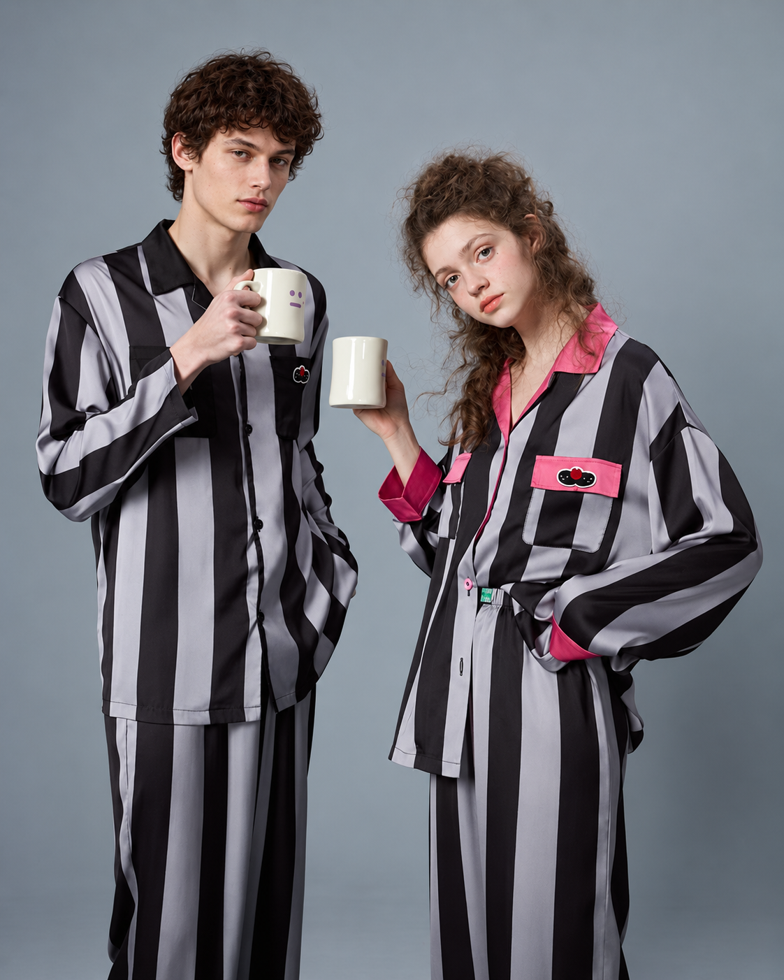 Men's striped pajama set – black lapels and striped shirt shown holding a mug - Roomden