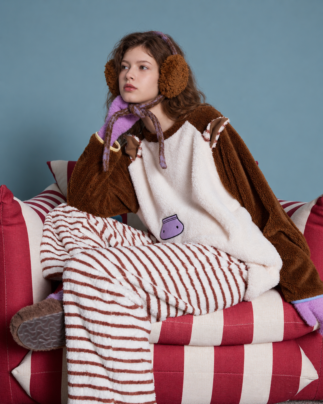 Horse-Ear Flannel Pajama Set – cross-legged seated view on a striped chair - Roomden