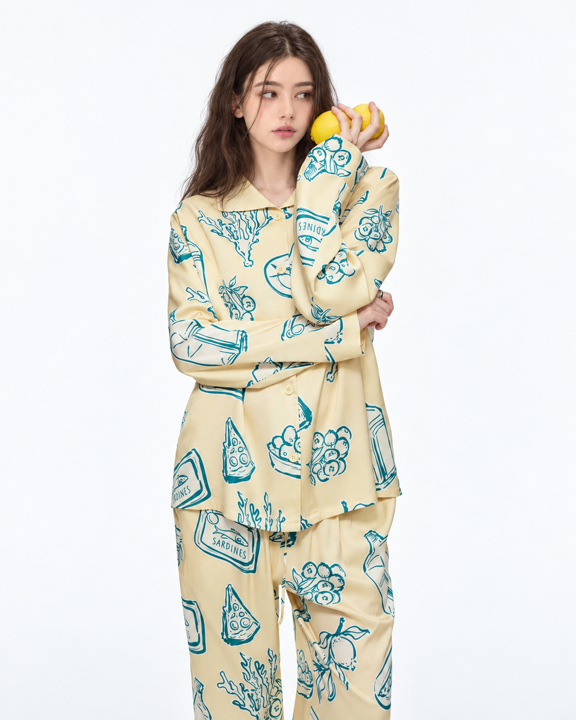 Food Sketch Viscose-Rayon Pajama Set – holding lemons in a close studio view - Roomden