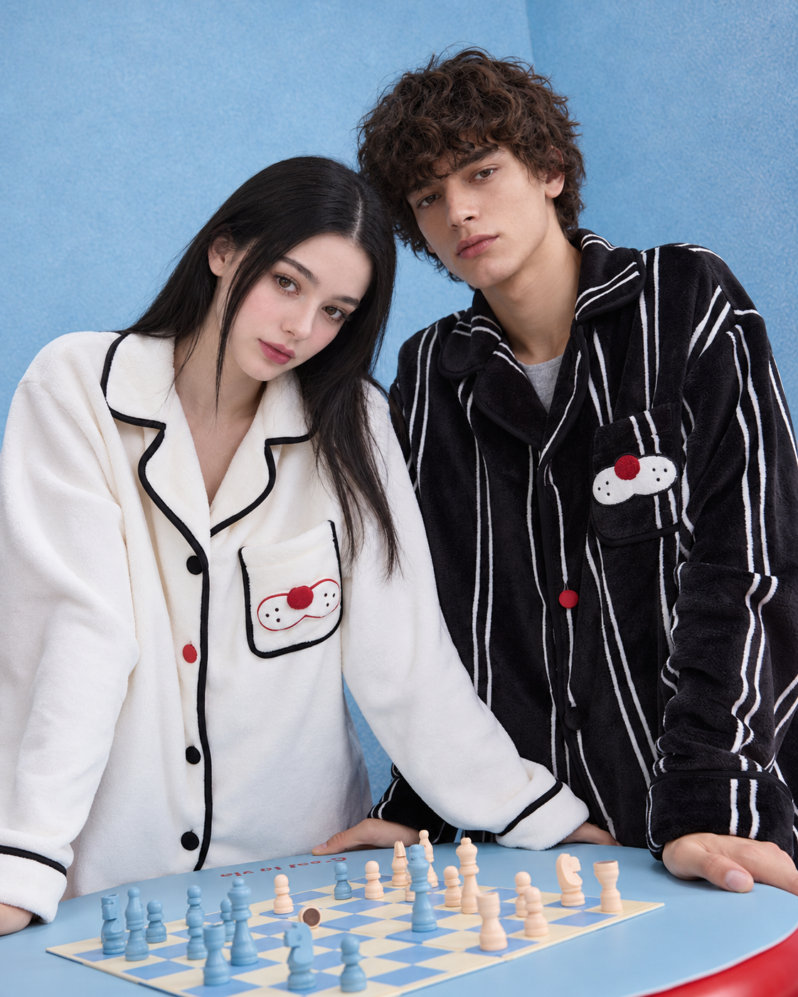 Men's Striped Cat-Pocket Fleece Pajama Set – Black, front view beside a chess table - Roomden