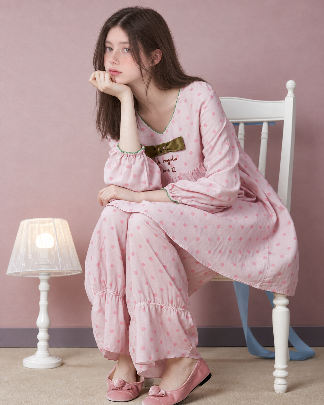 Polka Dot Bow Cotton Gauze Pajama Set – pink set, seated with chin resting on hand - Roomden