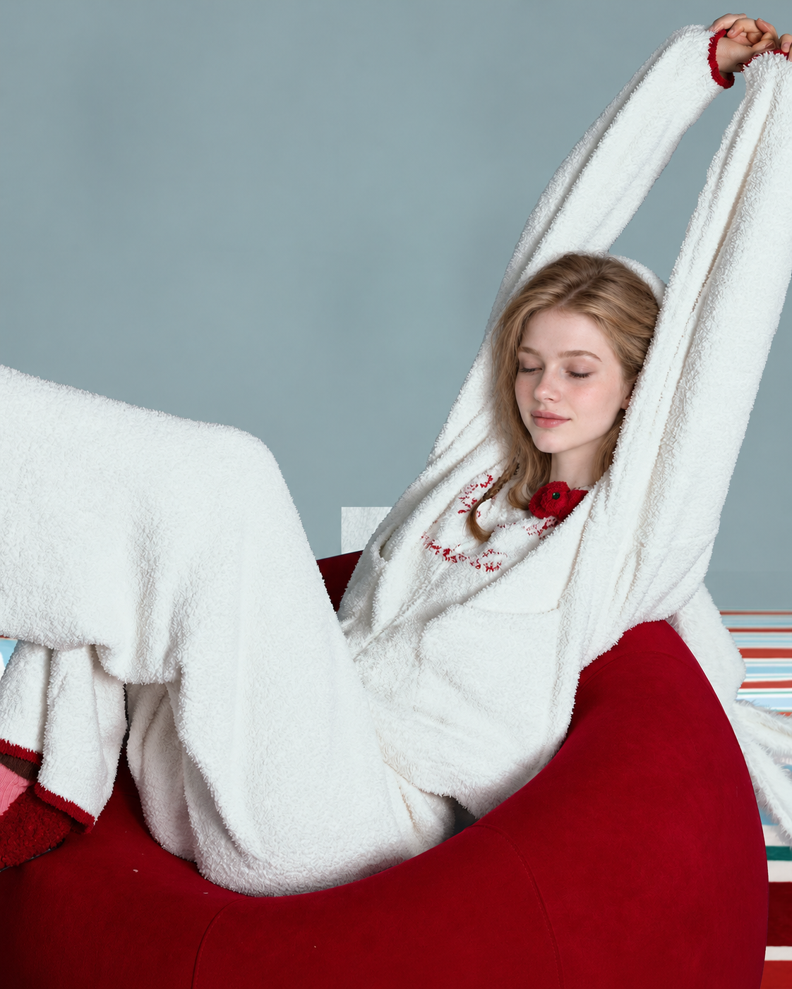 Red Bow Plush Pajama Set – ivory reclining view with arms stretched overhead - Roomden