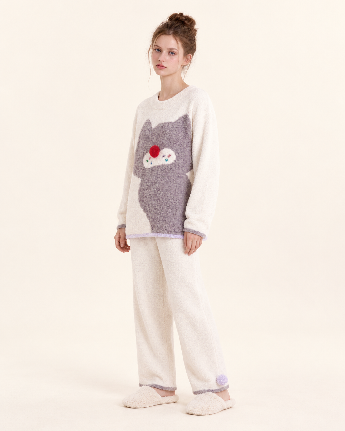 Ivory cat graphic pajama set – angled studio view of the cream long pants and lavender trim - Roomden