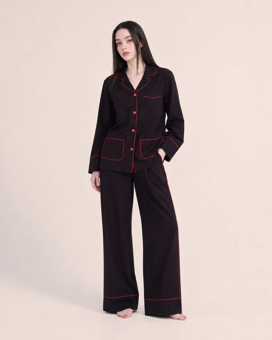 Linehaven contrast-piped pajama set in black, alternate studio pose - Roomden