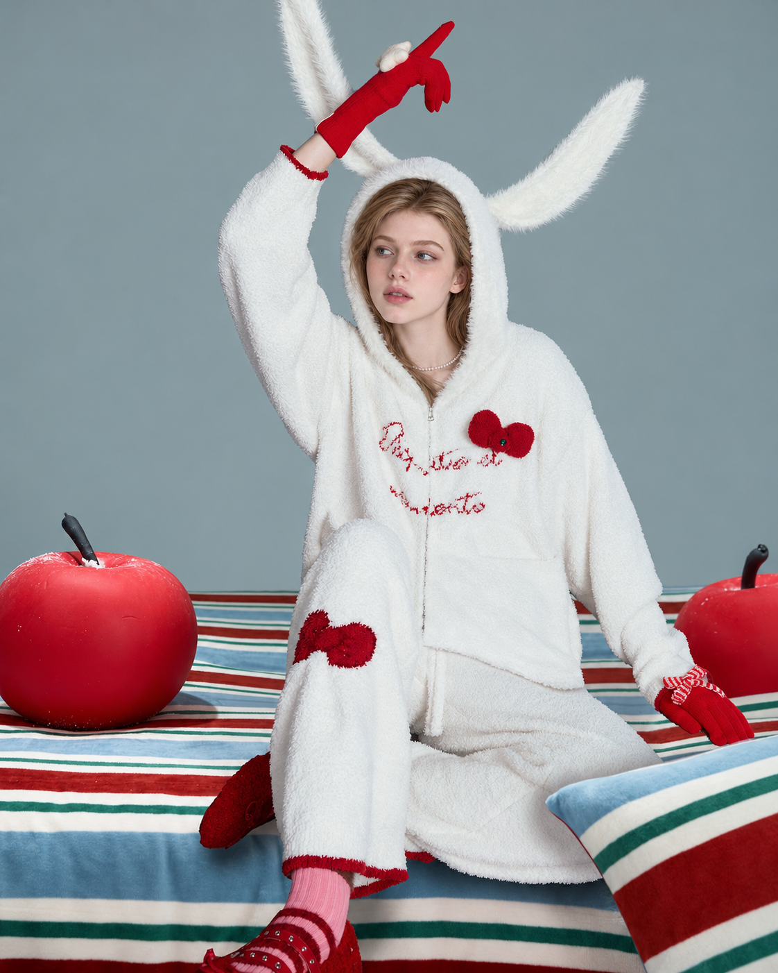 Red Bow Plush Pajama Set – ivory seated view with one arm raised - Roomden