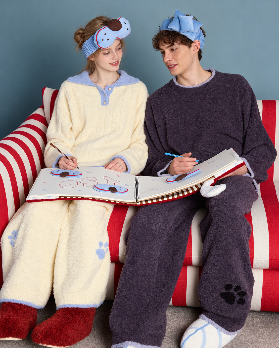Cat Motif Fleece Pajama Set - seated drawing scene showing paw-print trousers - Roomden