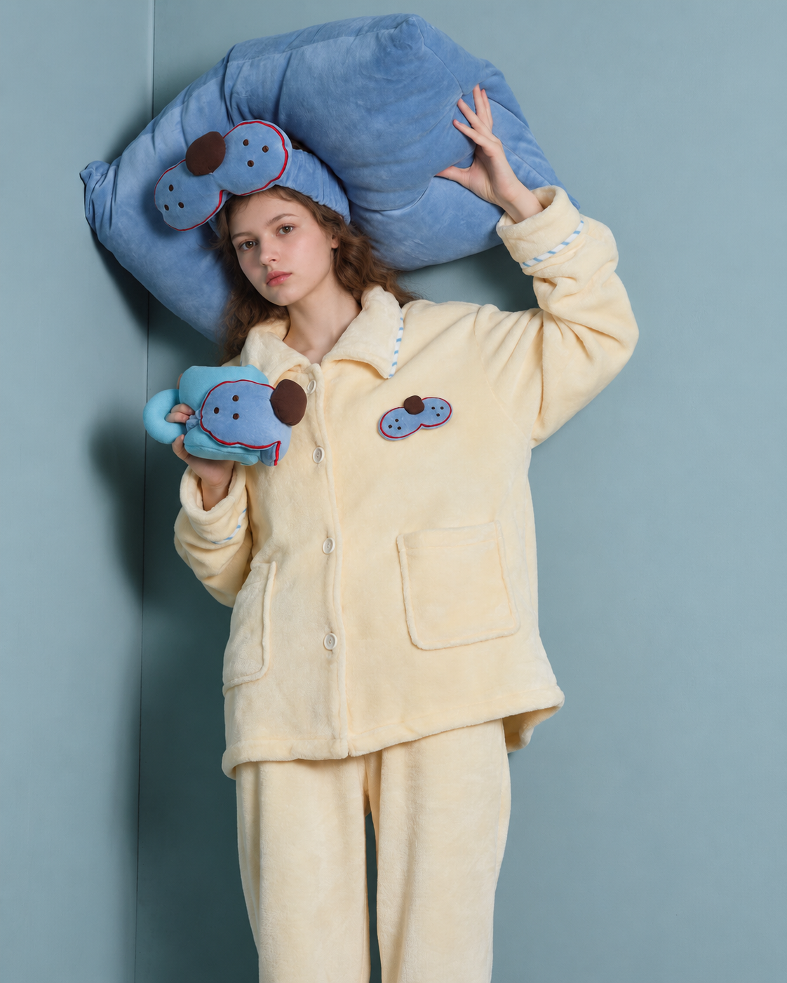 Cat Patch Fleece Pajama Set – cream yellow, raised-arm view showing the collar and front pockets - Roomden