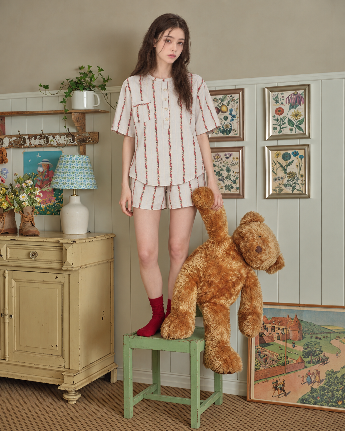 Roseledger cream rose-stripe pajama shorts set, standing in a vintage room - Roomden