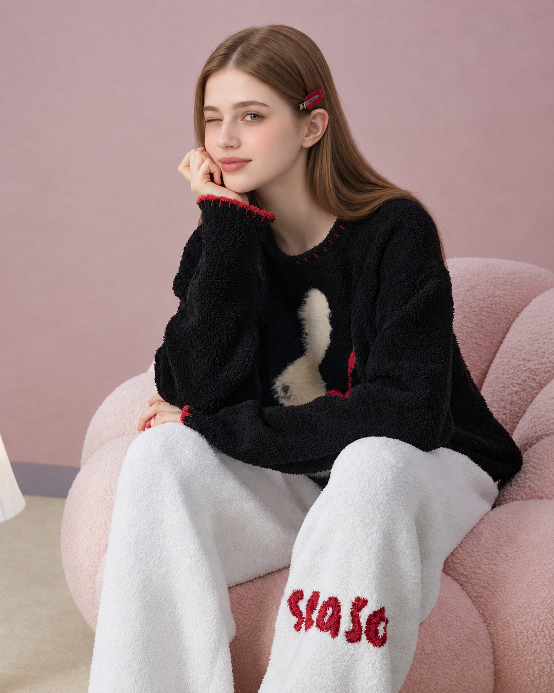 Rabbit & Bow Fleece Pajama Set – chin-resting seated view showing the trouser lettering - Roomden