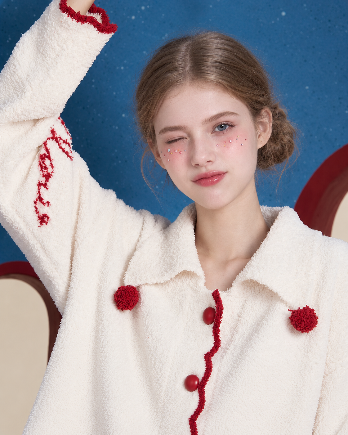 Pom-Pom Fleece Pajama Set – ivory waving upper-body view with red collar pom-poms - Roomden