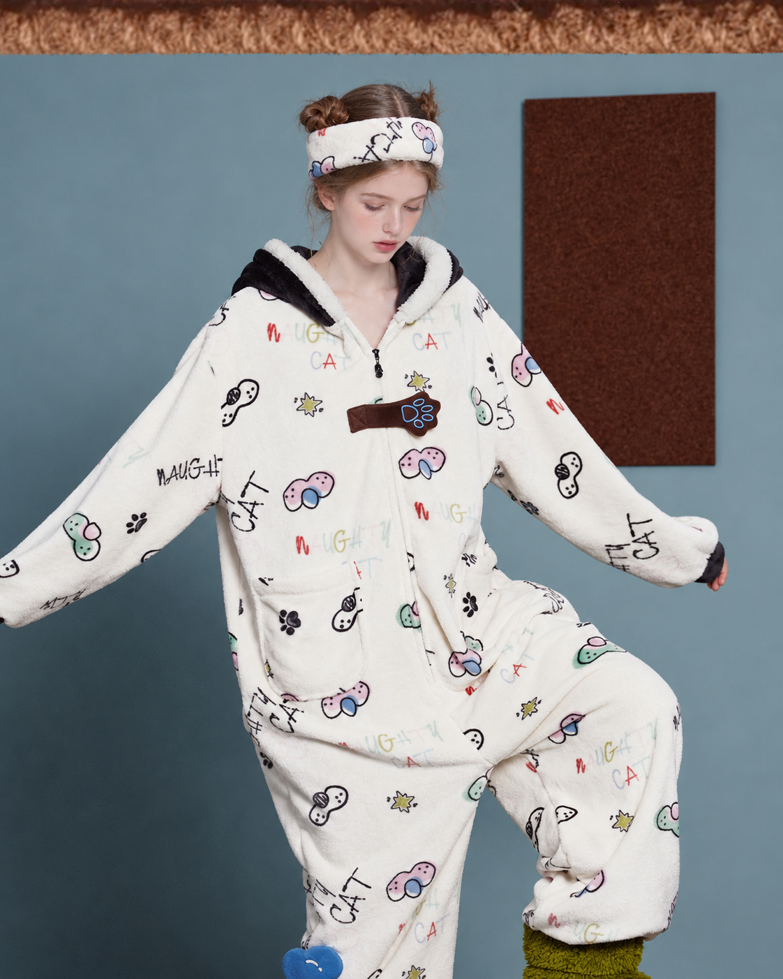 Doodlewhisk Cat-Doodle Hooded One-Piece Pajamas – raised-knee pose showing the loose silhouette - Roomden