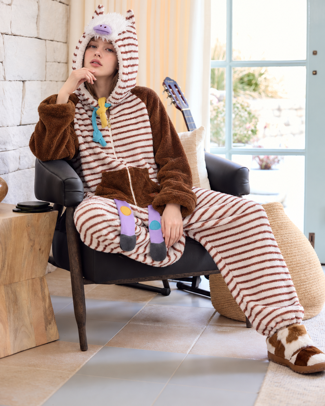 Striped Horse-Hood Onesie – window-side seated pose with hand near chin - Roomden