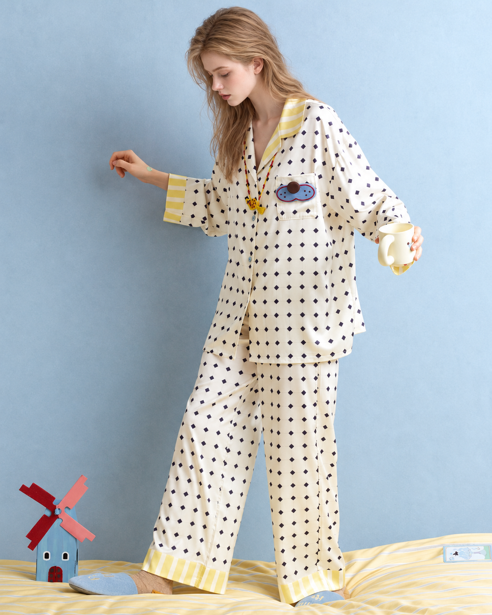 Lemonpause blue cat long-sleeve pajama set – full front view on a yellow bed - Roomden