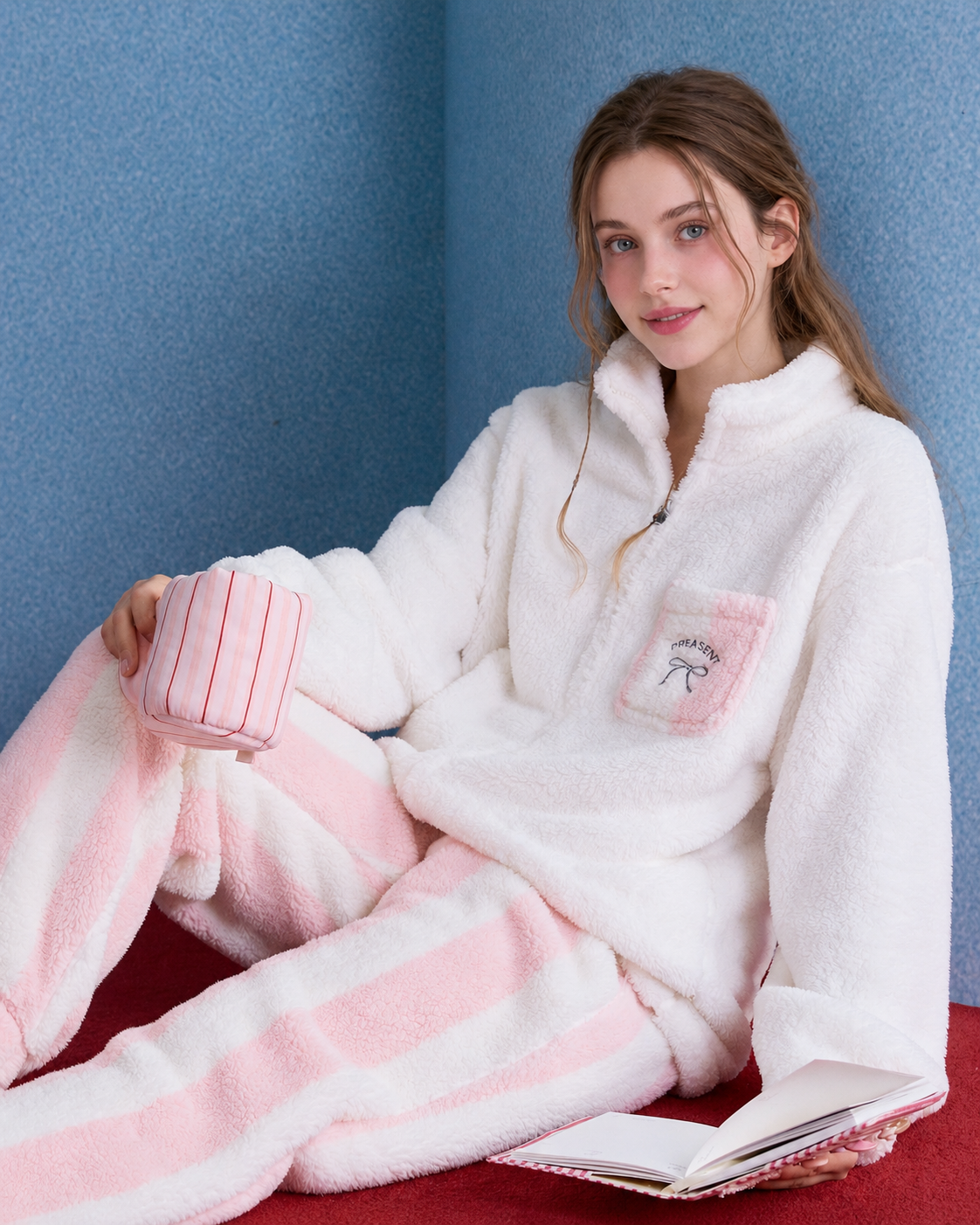 Bow Pocket Fleece Pajama Set – pink-and-white seated with a book and cup - Roomden