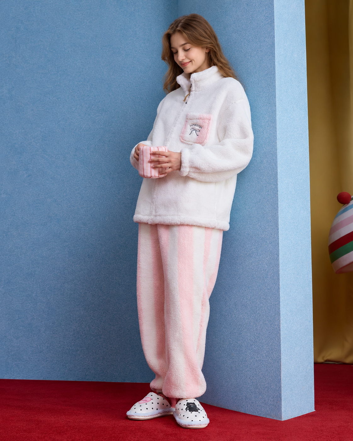 Bow Pocket Fleece Pajama Set – pink-and-white standing side view holding a cup - Roomden