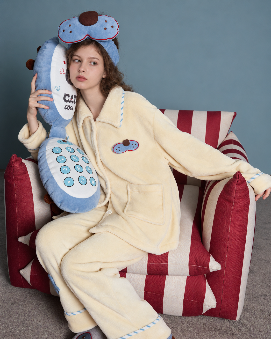 Cat Patch Fleece Pajama Set – cream yellow, seated view with the blue chest patch - Roomden