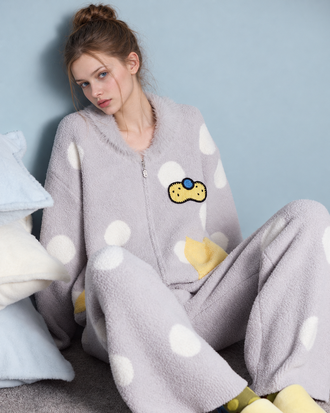 Polka Dot Fleece Pajama Set – seated close view of the chest motif and white dots - Roomden