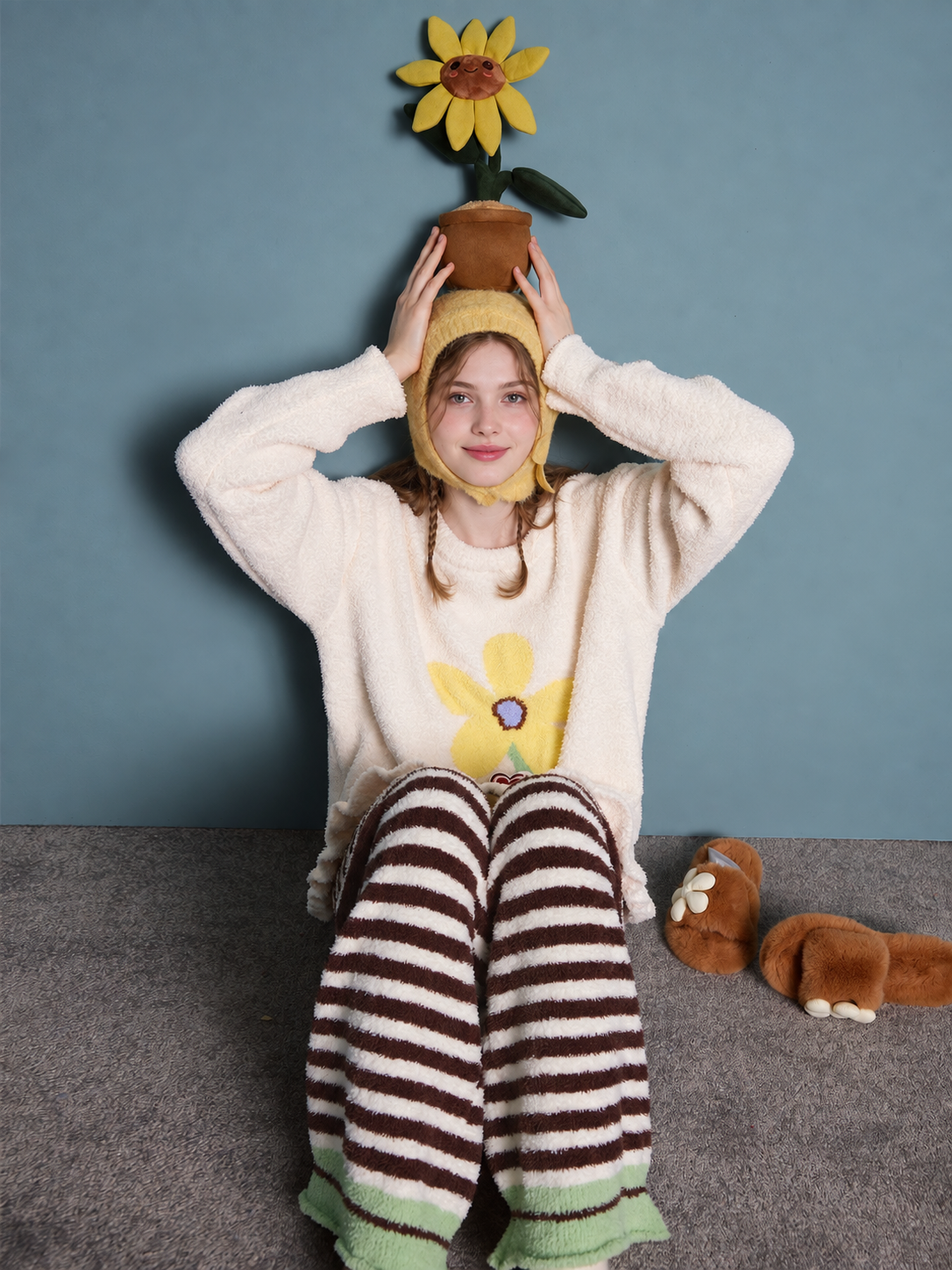 Flower pocket fleece pajama set – seated view with yellow flower detail and green trouser hems - Roomden