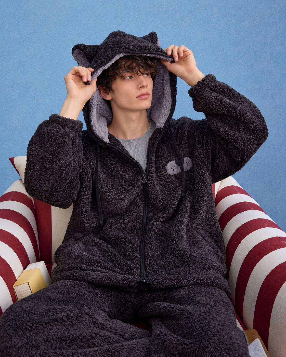 Dark gray cat-ear hooded fleece pajama set, male seated hood view - Roomden