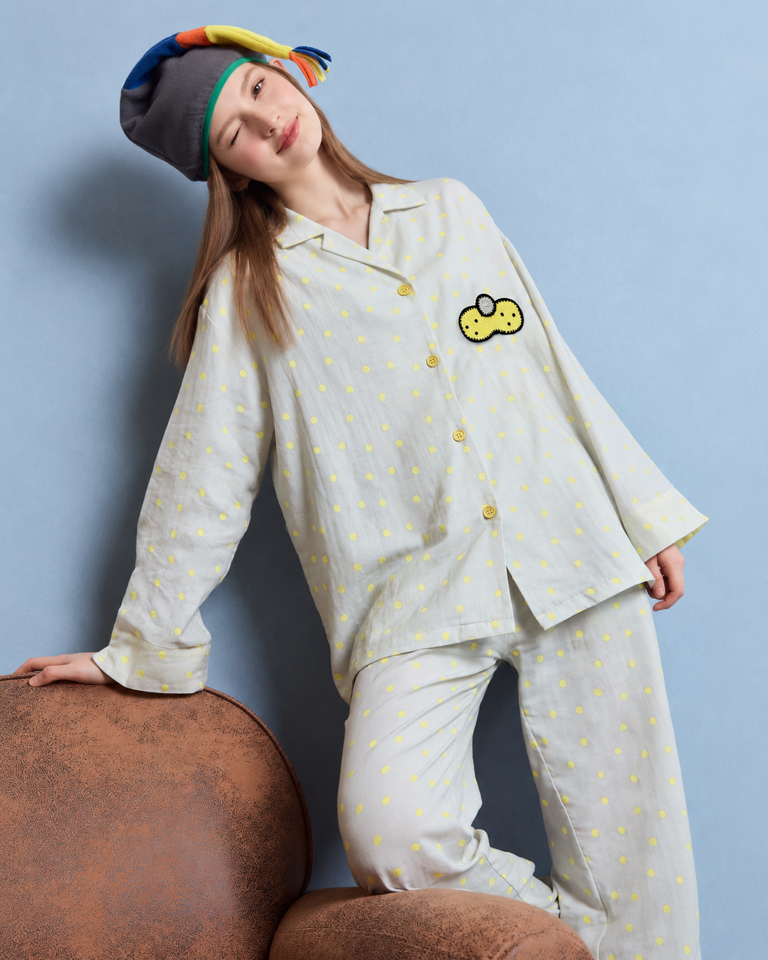 Women's gray and yellow dot cotton gauze pajama set – standing view leaning on an armchair - Roomden