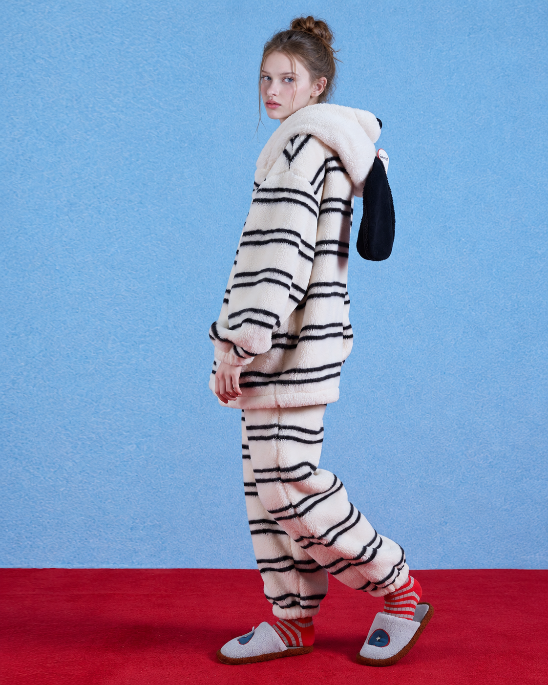 Striped Dog Hood Fleece Pajama Set – ivory and black striped side view with dog hood resting at the back - Roomden