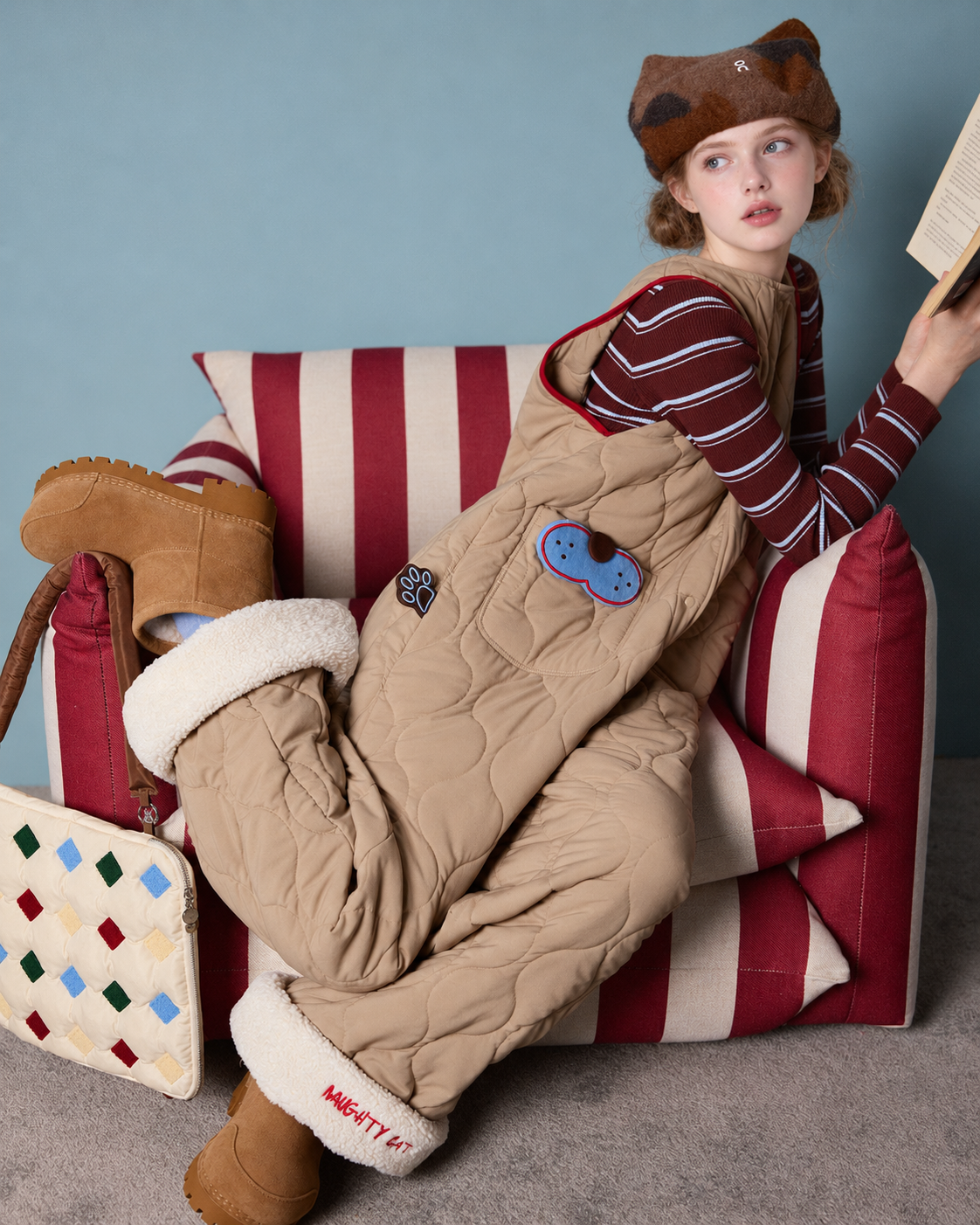Cat Pocket One-Piece Pajamas – side-seated reading view in khaki - Roomden