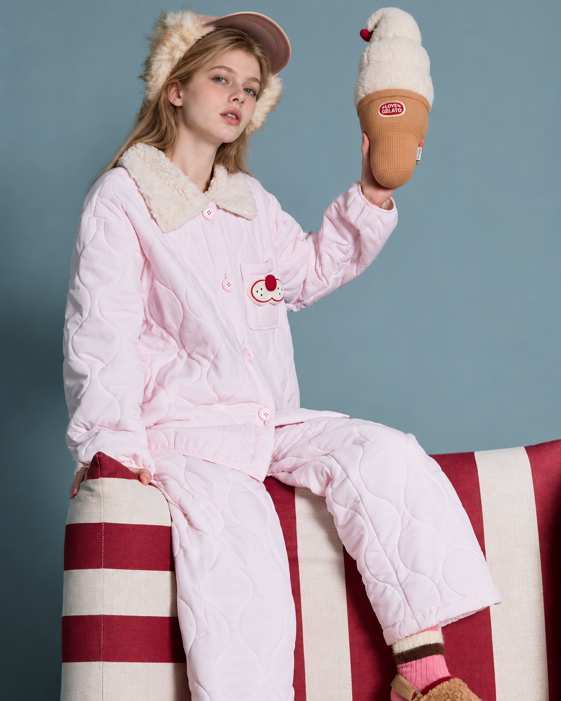 Cat Embroidery Quilted Pajama Set – pink seated on a striped chair with a raised ice cream prop - Roomden