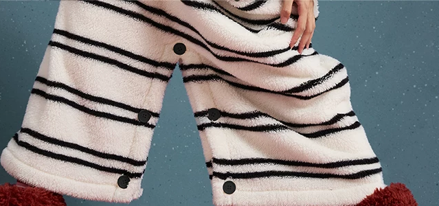 Whiskerbeat striped cat one-piece pajamas - lower button detail - Roomden