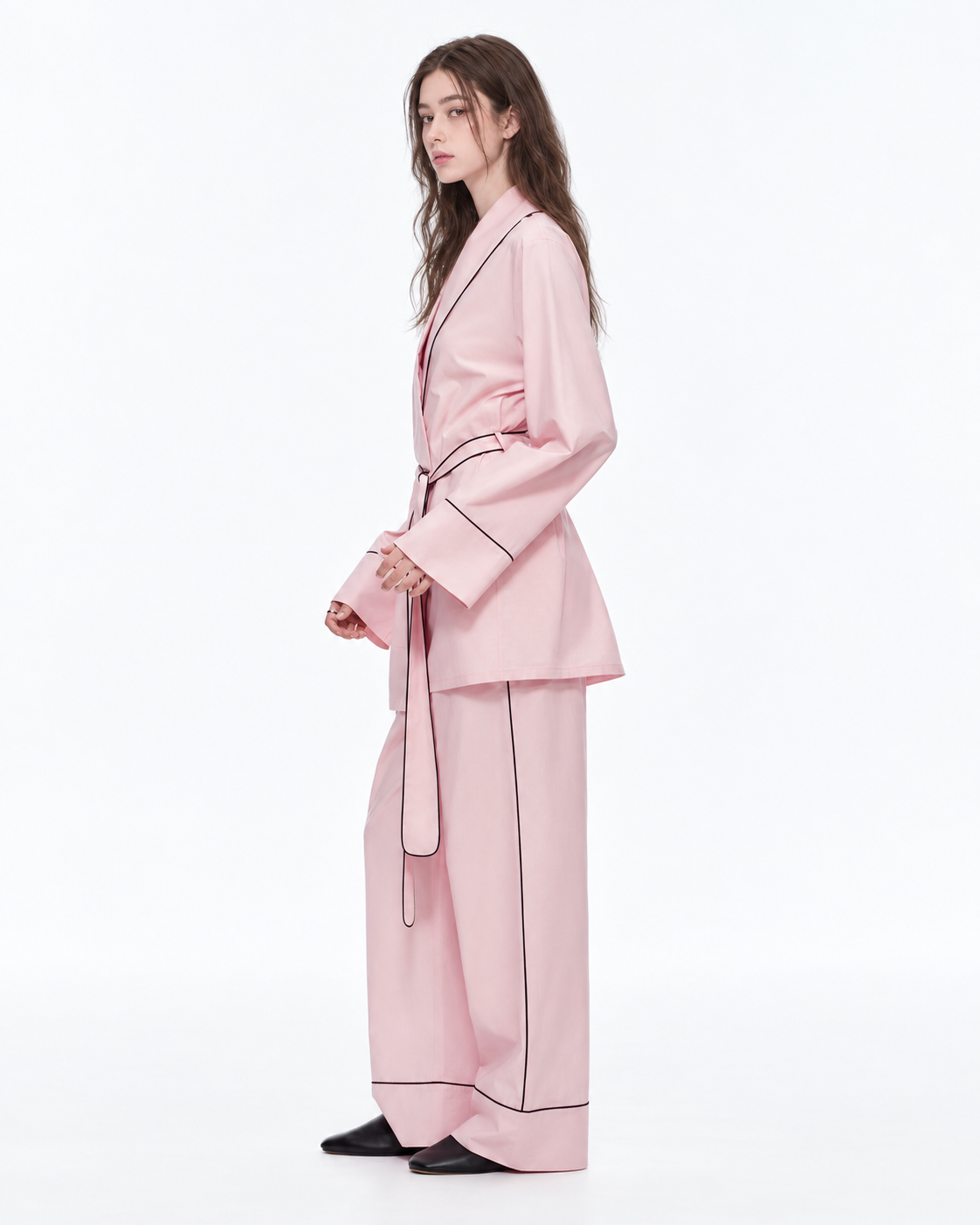 Linehaven wrap pajama set – Sakura Pink, side view looking back in the studio - Roomden
