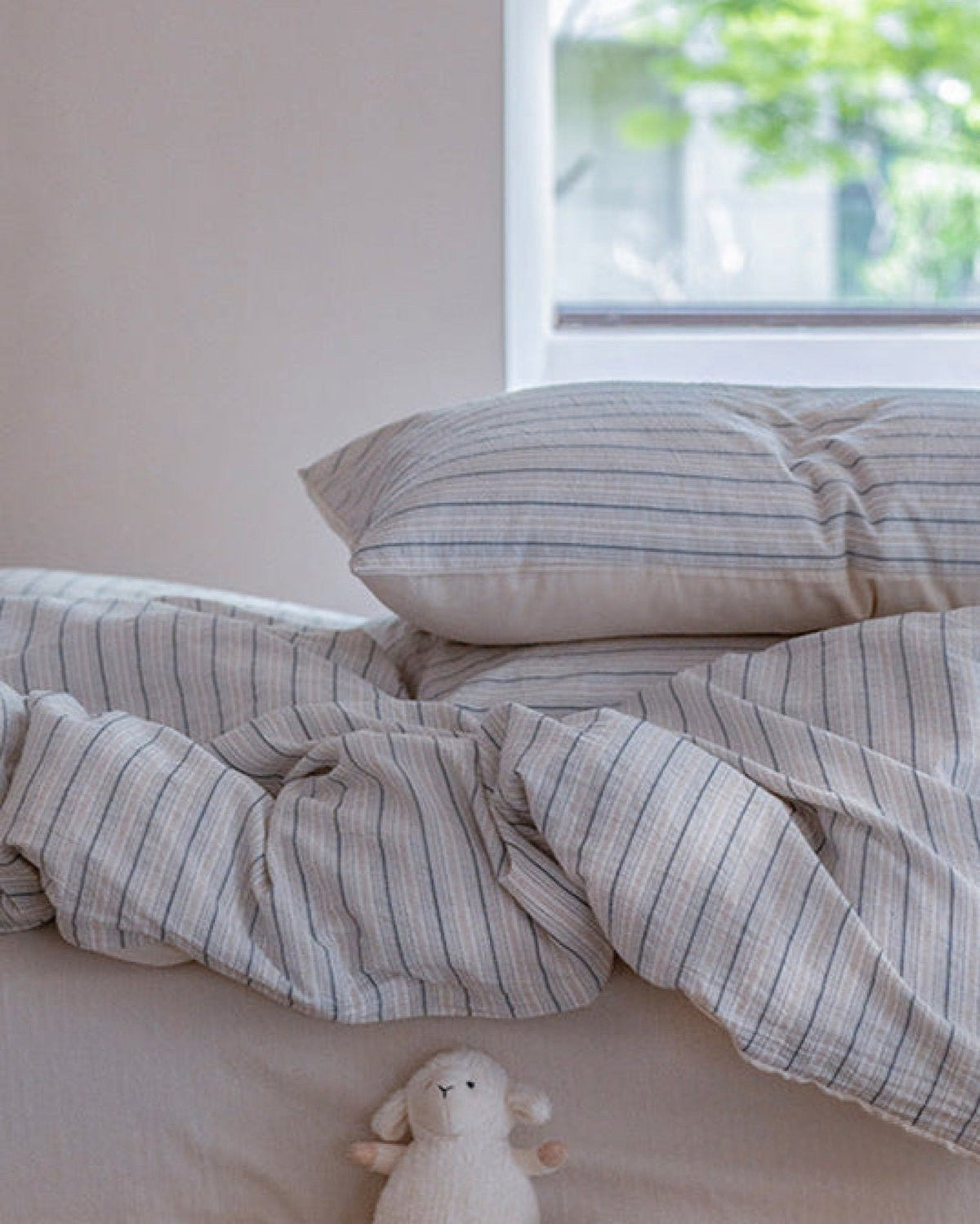 Winslet Pinstripe Cotton Bedding Set – pillow and duvet folds in soft window light - Roomden