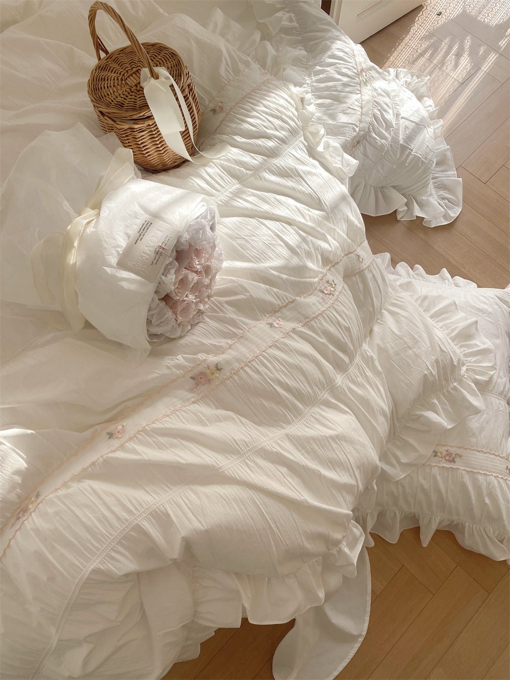 Winnifred Ruffled Washed Cotton Bedding Set – overhead view of gathered white fabric and ruffles - Roomden