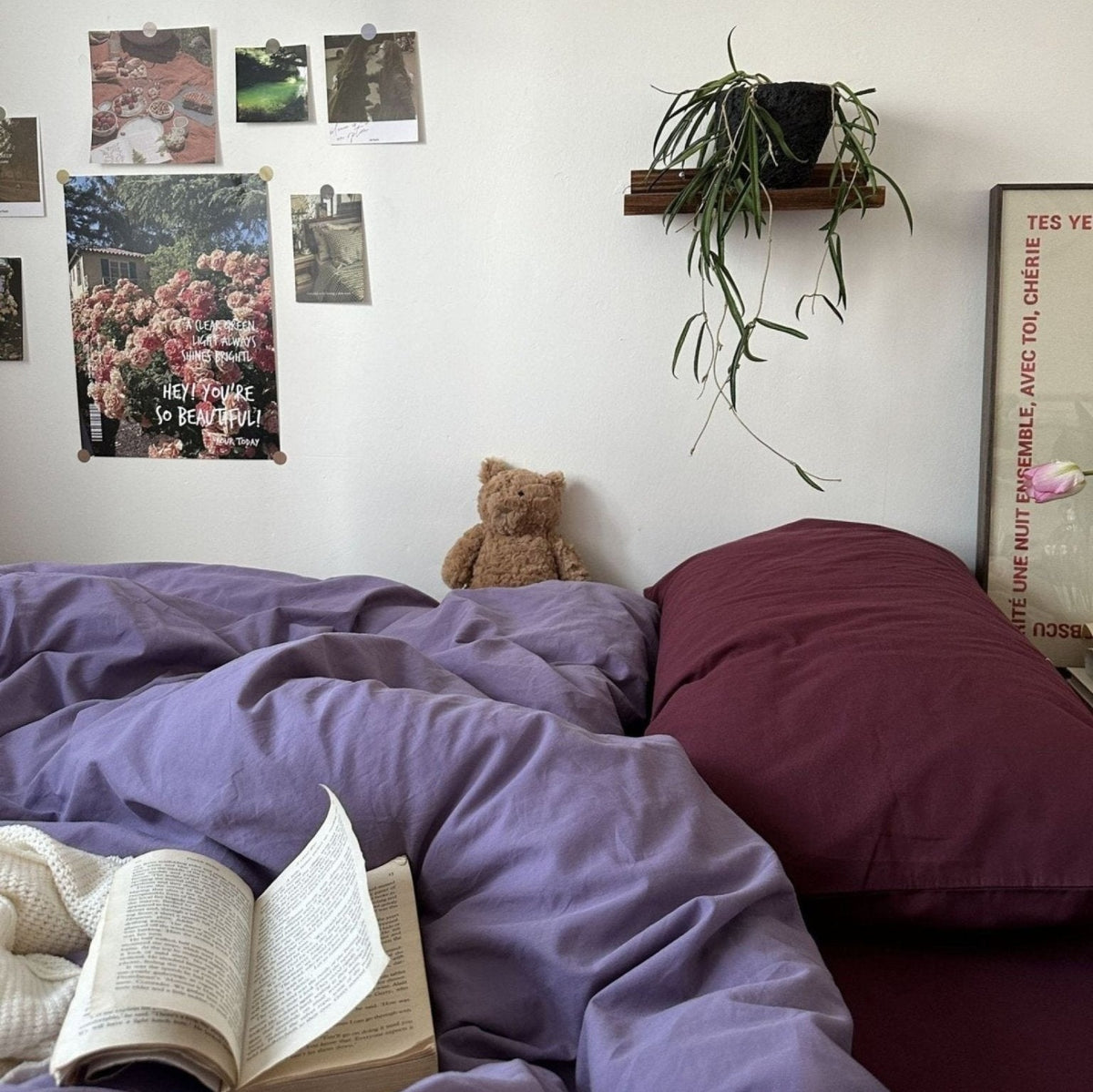 Thistle Plum Cotton Bedding Set – mixed purple pillows against a white wall - Roomden